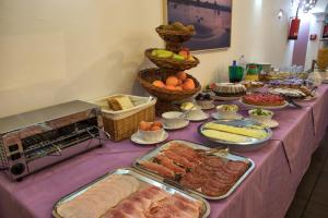 a table with many different types of food on it at Hotel O'scià in Lampedusa