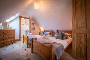 מיטה או מיטות בחדר ב-The Barn Culnacnoc