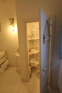 a room with a door and a room with a shelf at La Casina di Manon in Vinci +14 photos