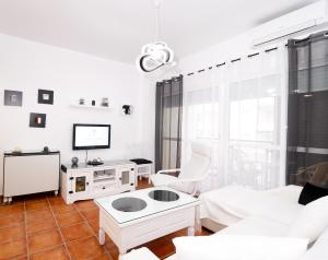 A television and/or entertainment centre at Summerland Apartments Rota