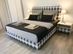 A bed or beds in a room at H75 Apartments Kosice Centre