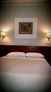 Letto o letti in una camera di Hotel Alpi Resort