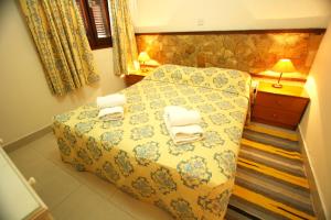 Ένα ή περισσότερα κρεβάτια σε δωμάτιο στο Sea View Apartments