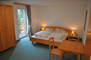 Ένα ή περισσότερα κρεβάτια σε δωμάτιο στο Ski Lodge Jaktman
