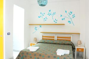 A bed or beds in a room at Camere D'Aragona