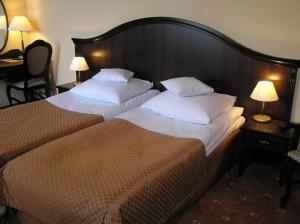 Posteľ alebo postele v izbe v ubytovaní Hotel Zamek Królewski w Rydzynie
