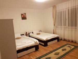 Postel nebo postele na pokoji v ubytování BigCitty Rooms