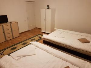 Postel nebo postele na pokoji v ubytování BigCitty Rooms