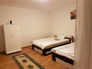 Postel nebo postele na pokoji v ubytování BigCitty Rooms