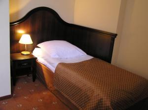 Posteľ alebo postele v izbe v ubytovaní Hotel Zamek Królewski w Rydzynie