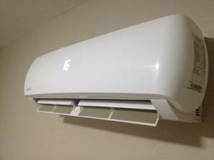 a white printer is hanging on a wall at Angel Guest House in Maputo