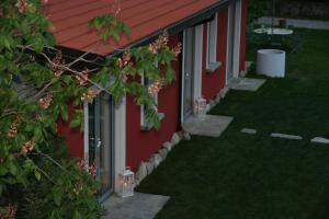 A garden outside La Baita Dinner & Bed