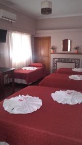 A bed or beds in a room at Posada La Casona