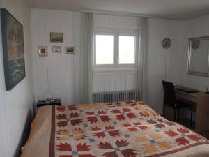 Un pat sau paturi într-o cameră la Gais Alpins