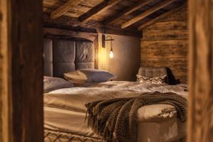 Ein Bett oder Betten in einem Zimmer der Unterkunft BelArosa Suiten & Wellness