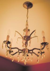 a chandelier hanging from a ceiling at Sir Edgar House B&B in Dauphin