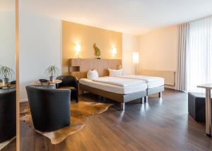 Postel nebo postele na pokoji v ubytování Hotel Westerkamp