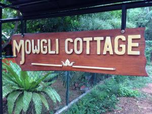 Naktsmītnes Mowgli Cottage logotips vai norāde
