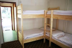 Łóżko lub łóżka w pokoju w obiekcie Hotel Medlov Depandance
