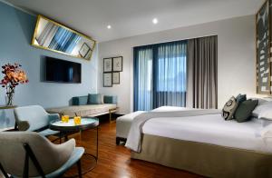 Postel nebo postele na pokoji v ubytování Hotel Pulitzer