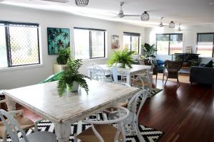 a living room with a table and chairs at Yeppoon Beachhouse in Yeppoon