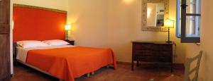 Tempat tidur dalam kamar di Locanda Della Quercia Calante