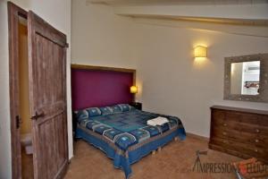 Cama o camas de una habitación en Locanda Della Quercia Calante