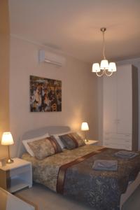 Postel nebo postele na pokoji v ubytování Residenze Principe Amedeo