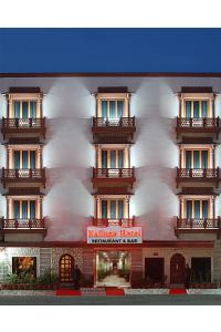 a building with a red sign in front of it at Kalinga Hotel in Jodhpur