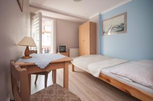 Postel nebo postele na pokoji v ubytování Pod Jaskółką