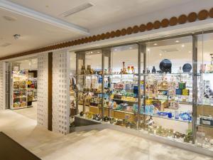 a store with glass doors and shelves of items at Sheraton Okinawa Sunmarina Resort in Onna