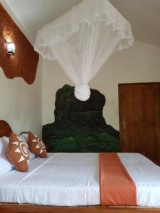 Letto o letti in una camera di Sigiri Heritage Villa