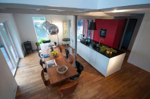 an overhead view of a kitchen with a table and chairs at Logbua - House on the Sea in Åna-Sira