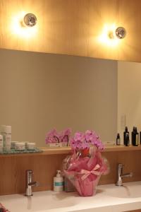 a bathroom with a sink with pink flowers on it at Guesthouse COCO Hiroshima (Female Only) in Hiroshima +37 photos