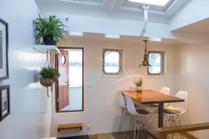 a kitchen and dining room with a table and chairs at M/S Svalbard B&B in Amsterdam