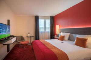 Кровать или кровати в номере Mercure Mulhouse Centre