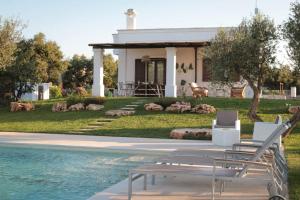 a house with a swimming pool next to a house at Villa del Vento in Polignano a Mare