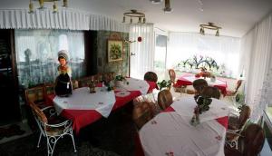 a group of children sitting at tables in a restaurant at Sobe apartma Milena in Bled