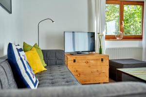 Televízia a/alebo spoločenská miestnosť v ubytovaní Emily's Ferienwohnung