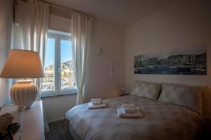 A bed or beds in a room at Ci'Cala House