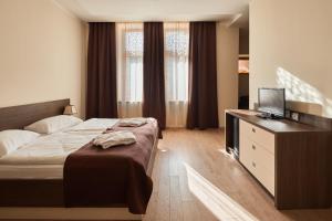 Voodi või voodid majutusasutuse Hotel Gino Wellness Rabath toas
