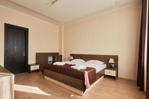 Voodi või voodid majutusasutuse Hotel Gino Wellness Rabath toas