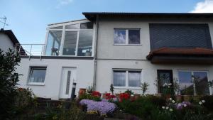 a house with a large window on top of it at Ferienwohnung chez nous in Erbach im Odenwald