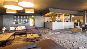 a large living room with couches and a table at Thon Partner Hotel Horten in Horten