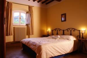 Ліжко або ліжка в номері Re Artù Assisi Country Lifestyle