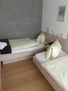Postel nebo postele na pokoji v ubytování Hotel Belmont