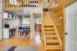 a tiny house with a staircase leading to the kitchen at Loft y Cabañas Ensenada in Los Riscos