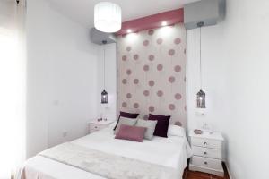 A bed or beds in a room at Summerland Apartments Rota