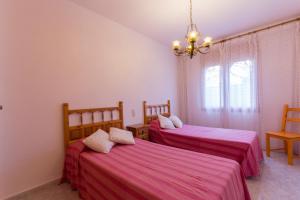 Posteľ alebo postele v izbe v ubytovaní INNOUTHOME Casa Piscina