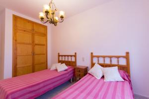 Posteľ alebo postele v izbe v ubytovaní INNOUTHOME Casa Piscina